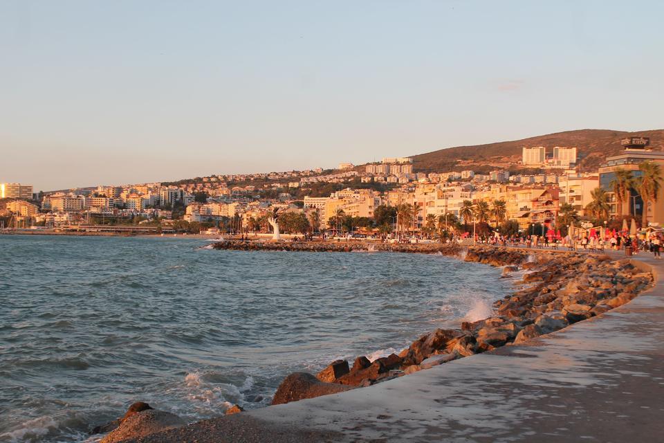 Waves along the Kusadasi seafront promenade at sunset