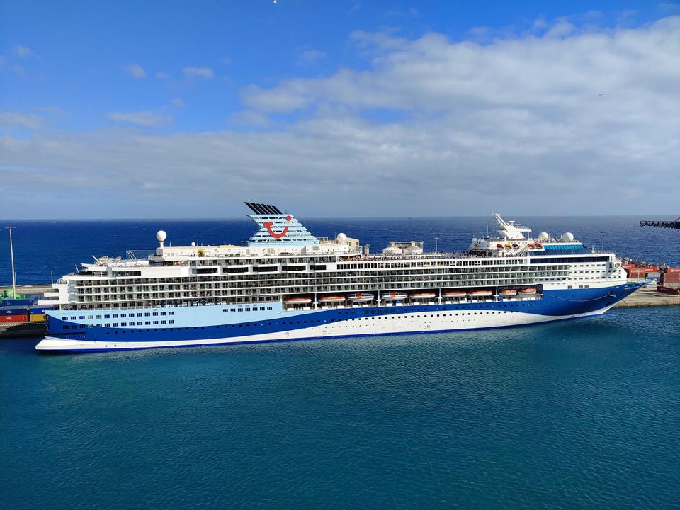 Marella Explorer cruise ship in blue-and-white livery, red smile on funnel, docked at Fuerteventura