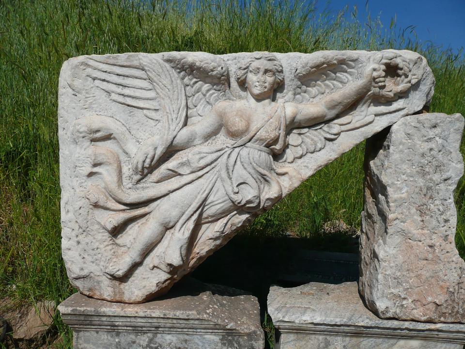 Carved marble relief of the winged goddess Nike at the ancient site of Ephesus